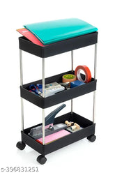 Black plastic vegetable kitchen trolley with three shelves, ideal for organizing fresh produce at home